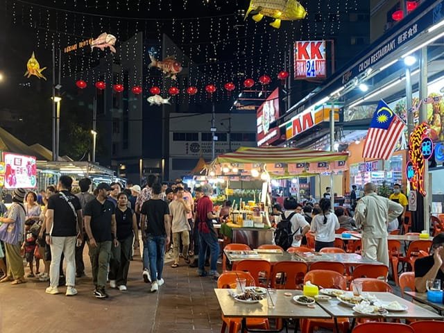 People walking on a food street at night