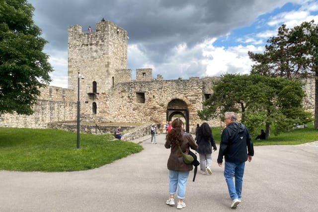 People walking towards a fortress