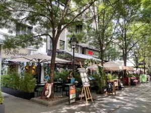 A street lined with restaurants and trees