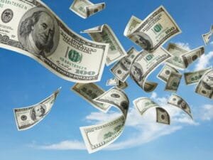 100-dollar bills blowing through the sky