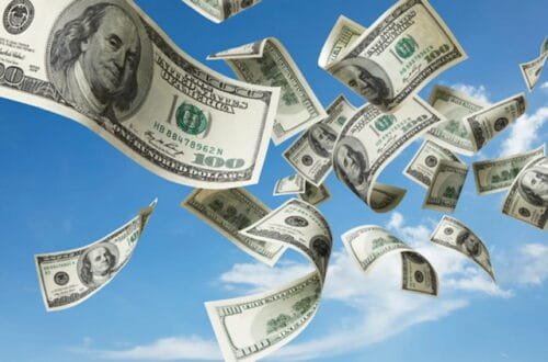 100-dollar bills blowing through the sky