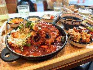 A tray of food including octopus
