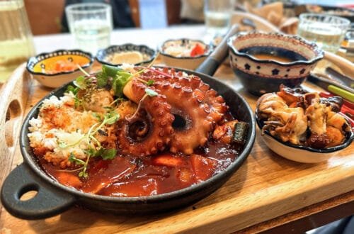 A tray of food including octopus