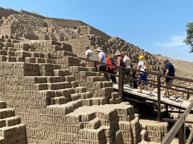 A group of people walking up a ramp