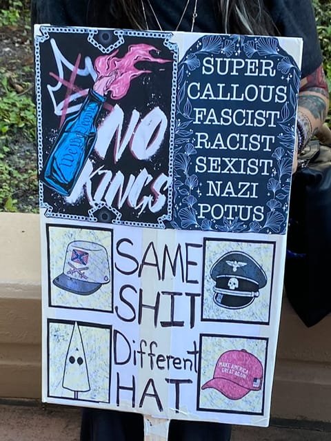 No Kings protest sign with “Super calolous fascist racist sexist nazi potus” and Sam shit, different hat”