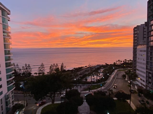 A sunset over a body of water as seen from up high