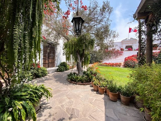 A plant-filled walkway at the Larco Museum
