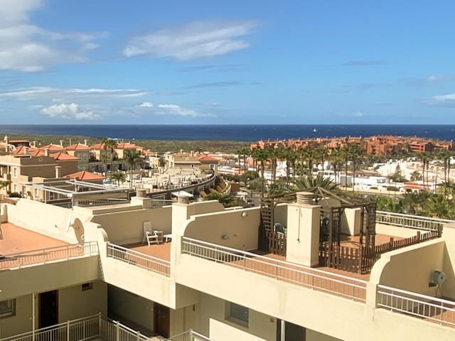 A view of rooftops and the ocean