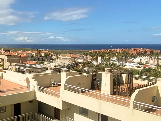 A view of rooftops and the ocean