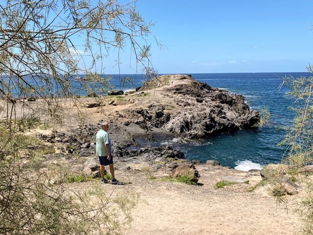 A man on a rocky shore