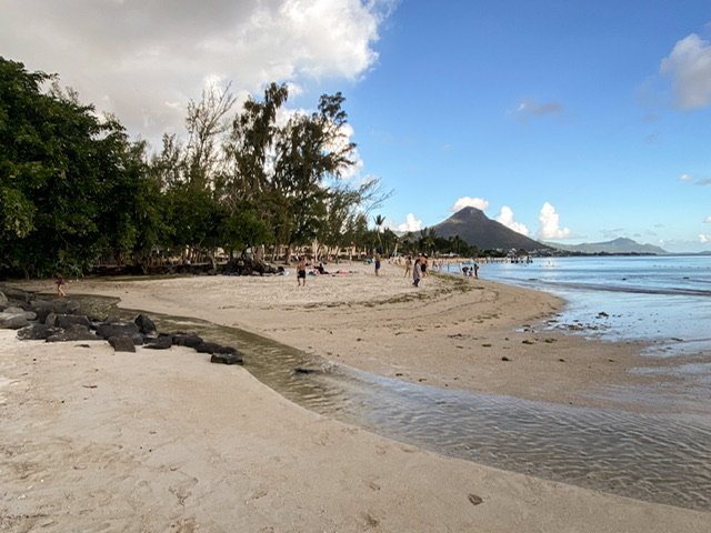 A shallow and narrow river running over sand