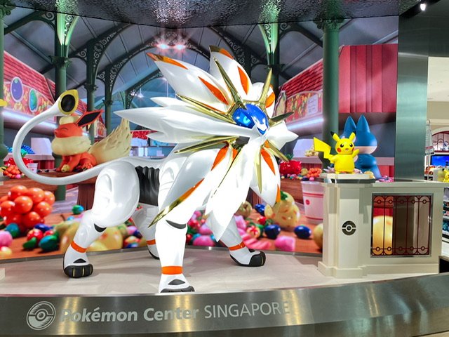 Pokemon statues in a storefront